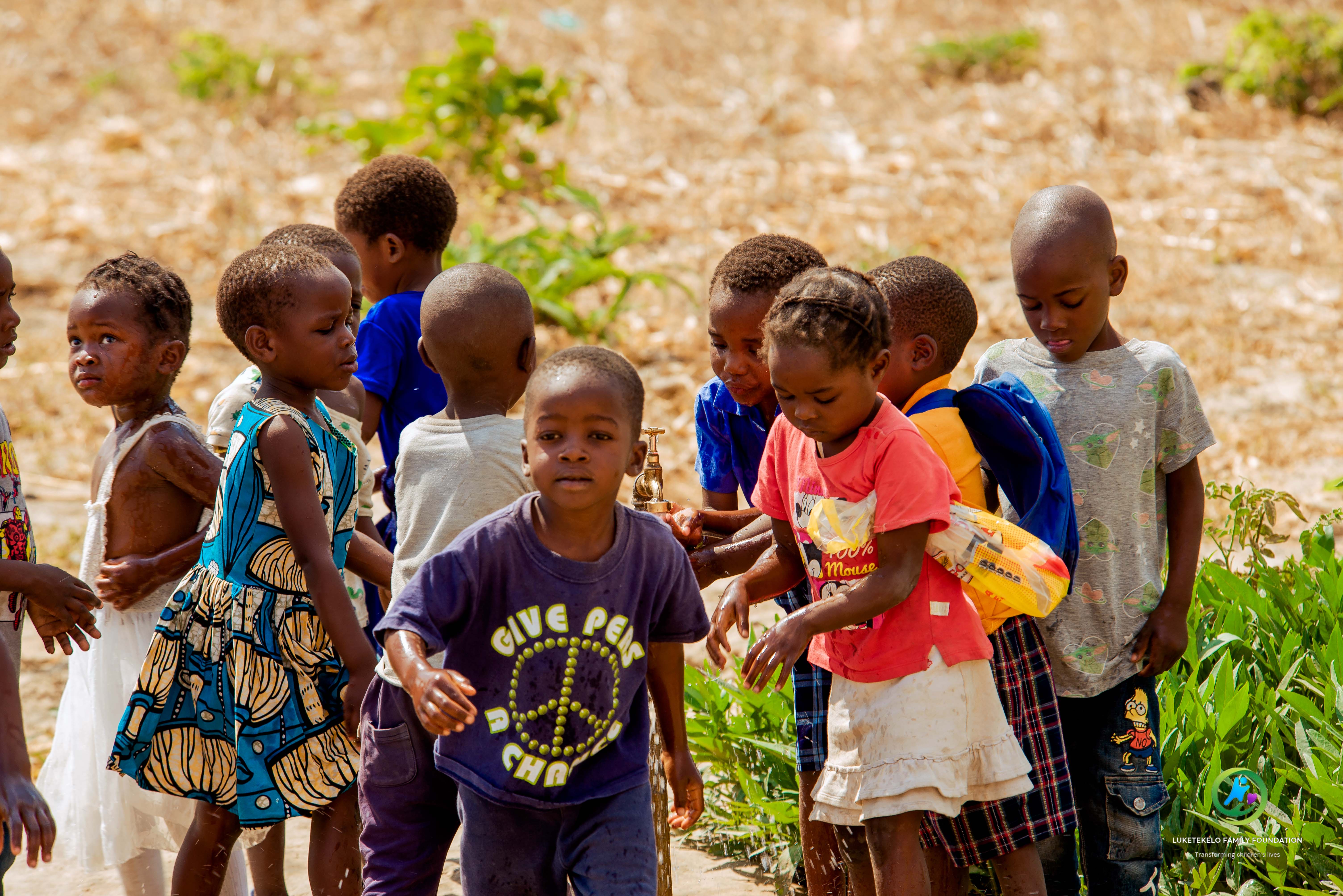 Children from Faith Family Foundation programs smiling and celebrating together